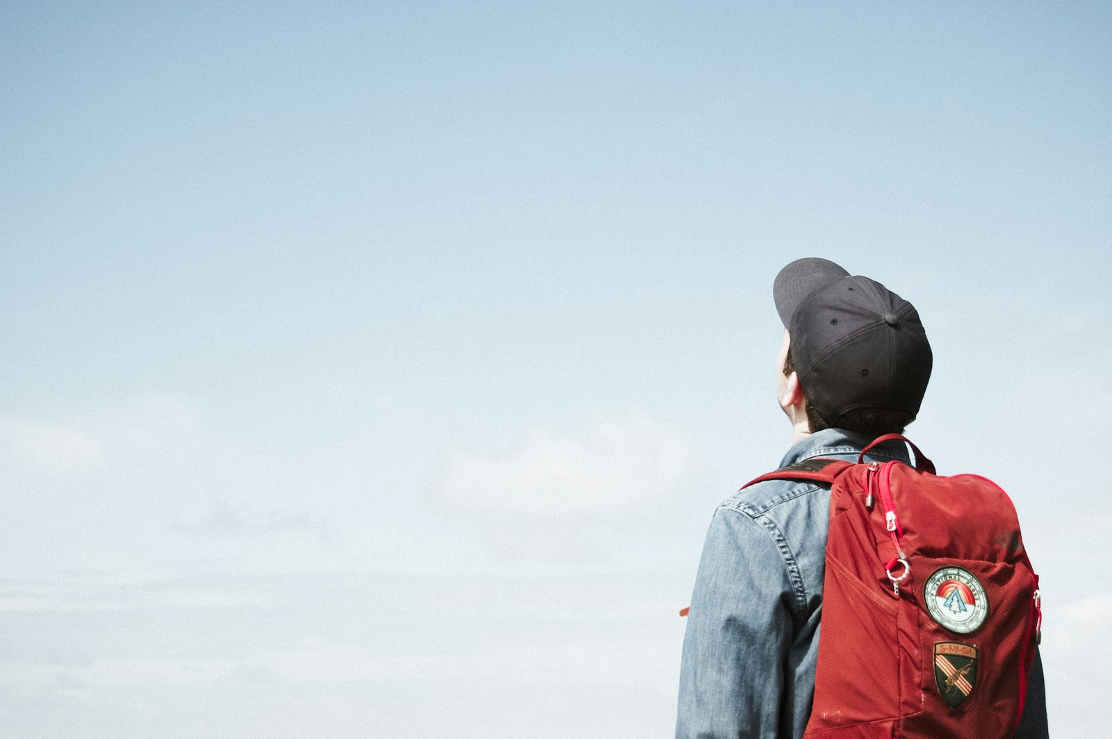 Photo by Matese Fields man staring at white sky taken at daytime